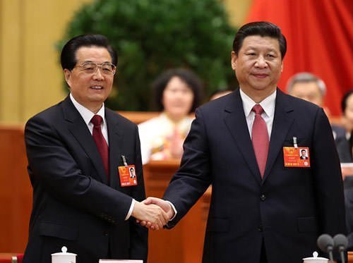 Outgoing Chinese President Hu Jintao left congratulates his successor Xi Jinping