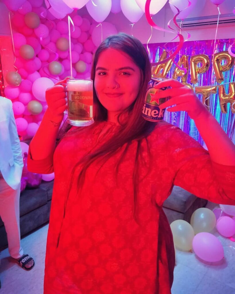 Anjali with a glass of beer