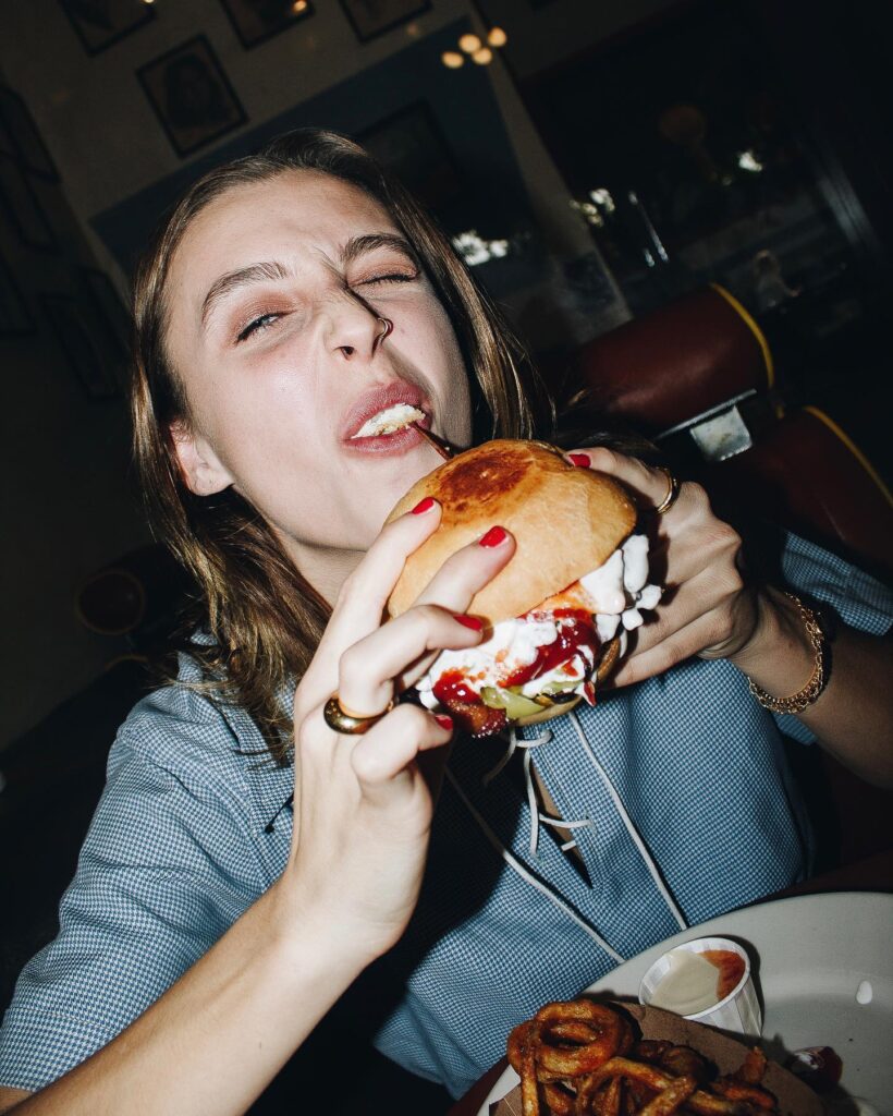 Emma eats burger