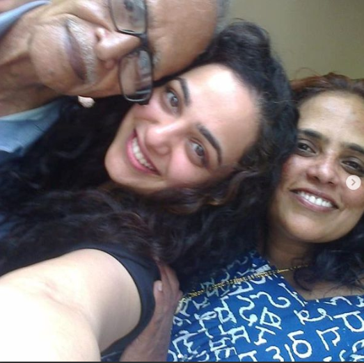 Nithya with her mother and grandfather