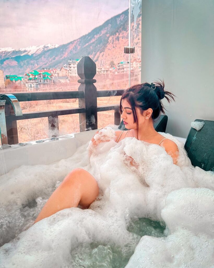 Surbhi bathing in a bathtub