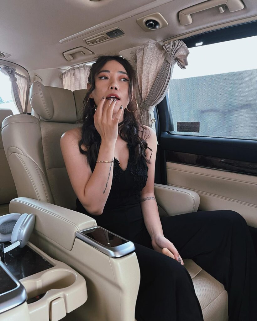 Wendy in her luxury car