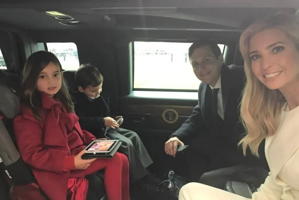 Jared in his luxury car with his family
