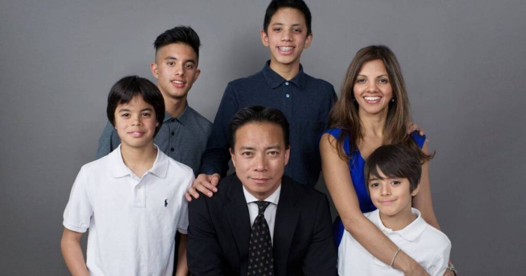 Ken Sim with his family