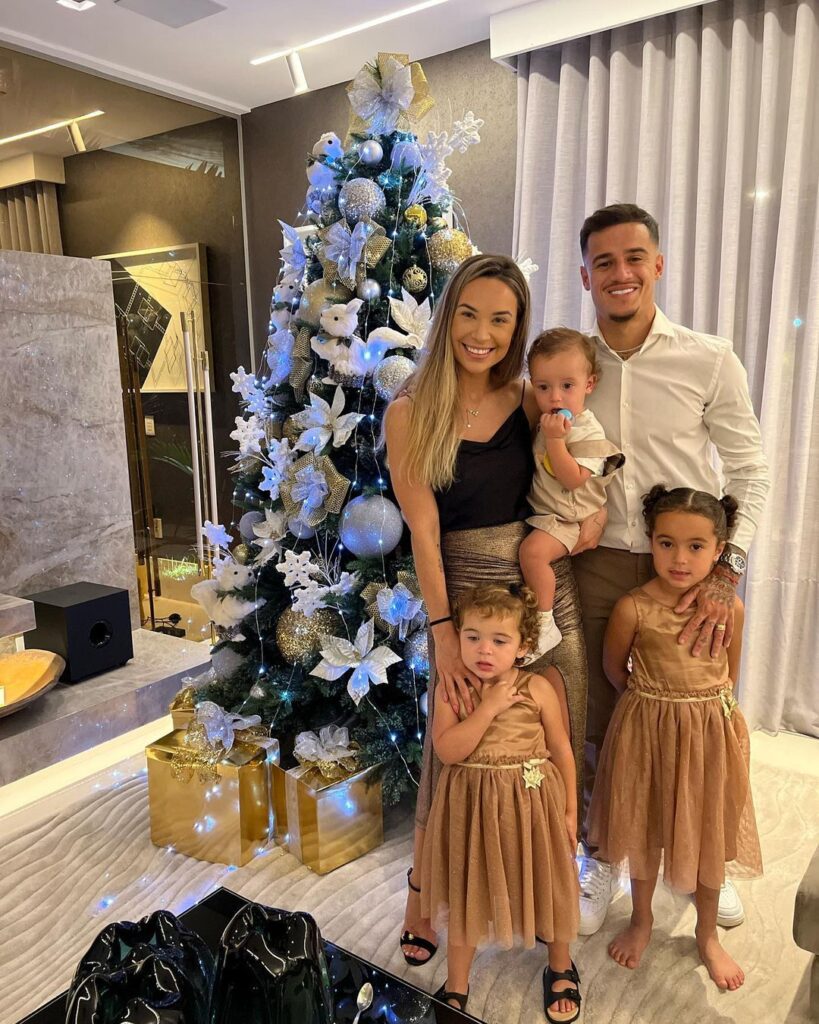 Philippe Coutinho with his wife and children