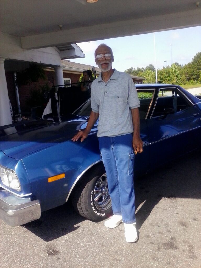 Leon Lamar with his car