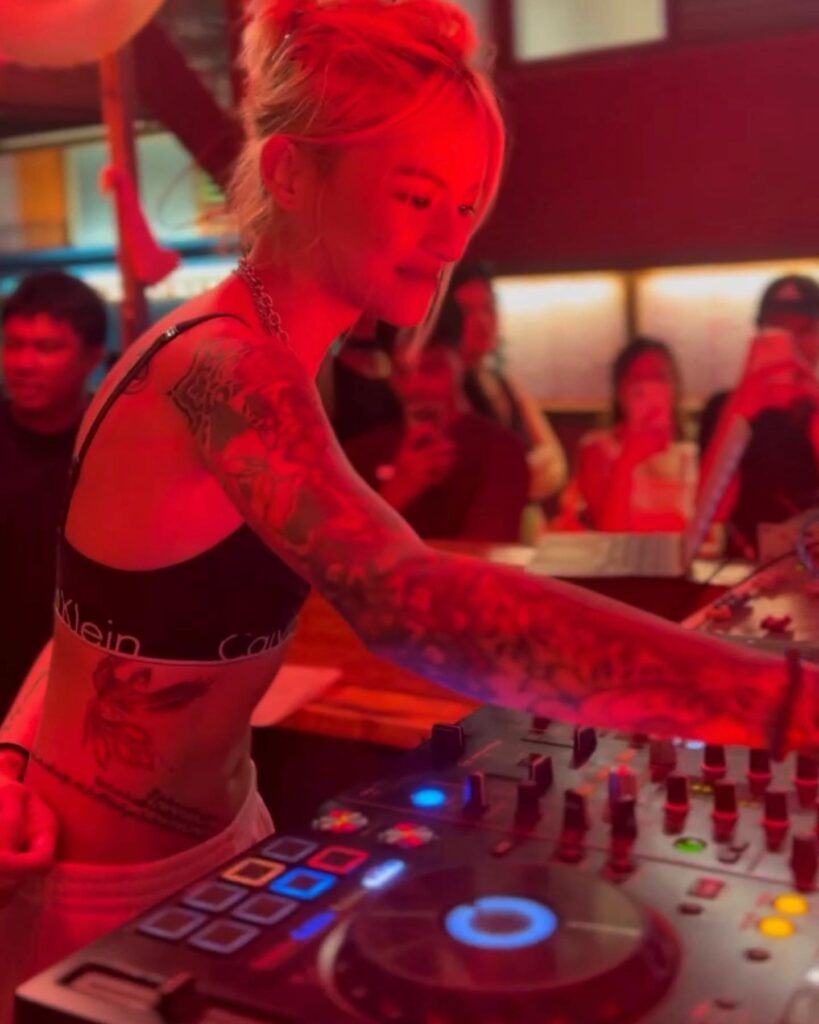 Patty Tiu in a night club as DJ