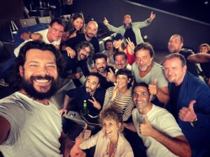 Alvaro Morte with his La Casa De Papel cast team
