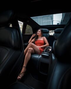 Christine Tran Ferguson in her luxury car