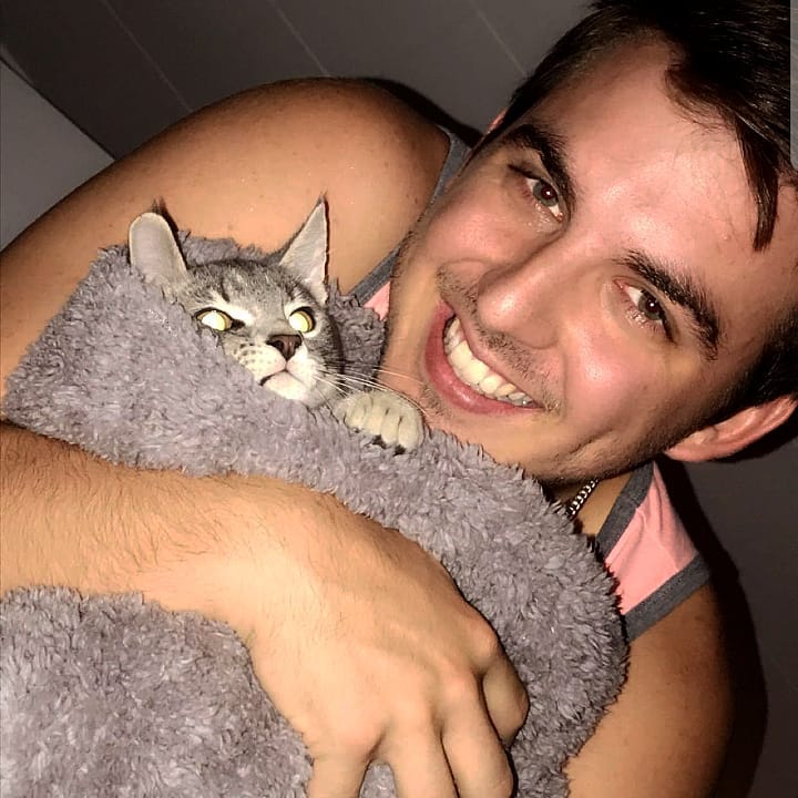Chris Tyson with his pet cat
