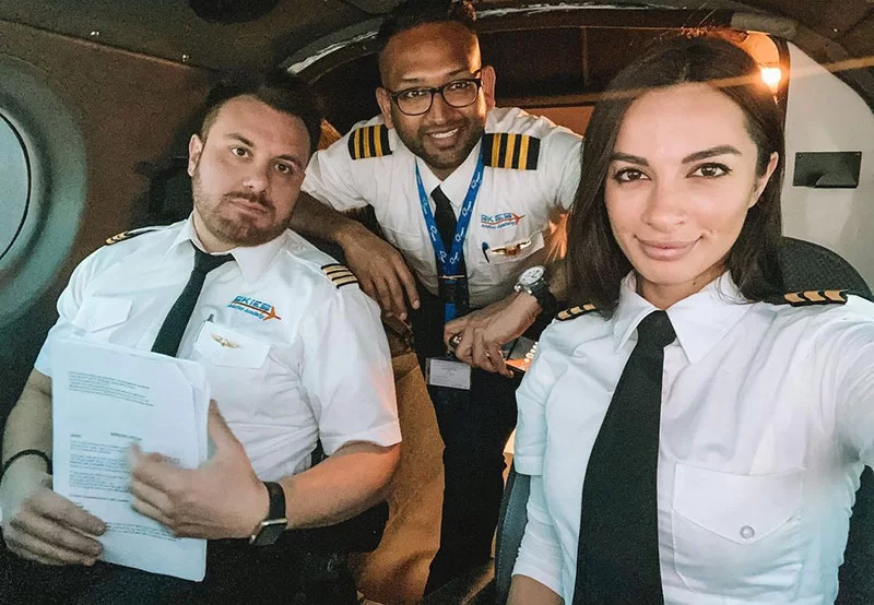 Christina Carmela with his cabin crew as a Pilot