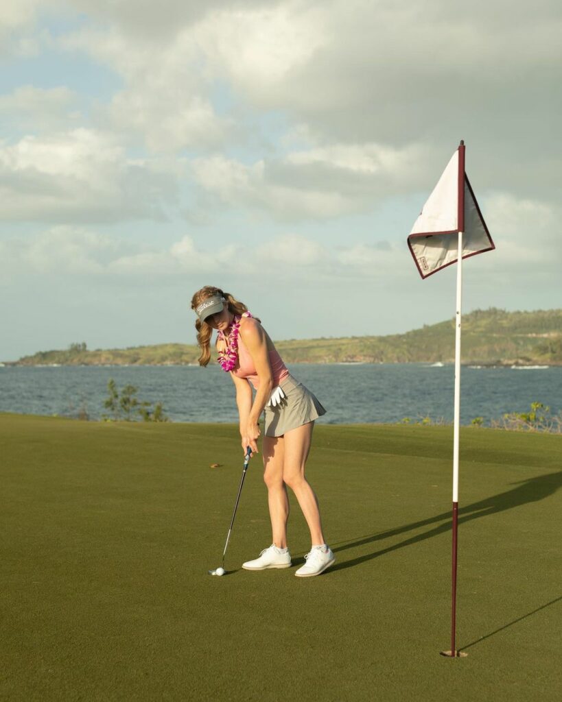 Grace Charis playing golf