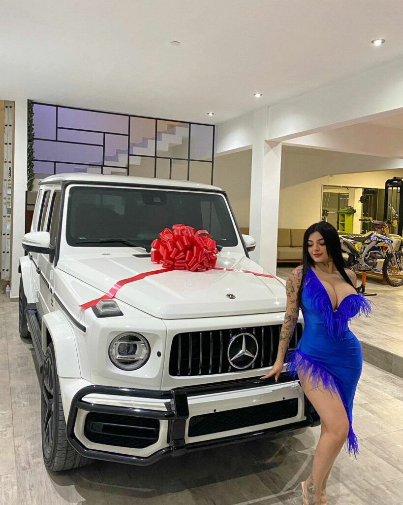 Karely Ruiz with her luxury car