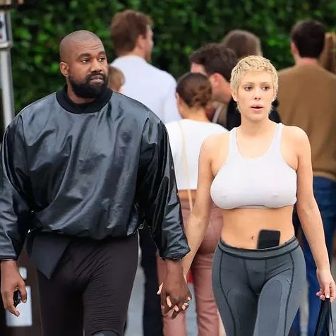 Bianca Censori and Kanye West hold hands together
