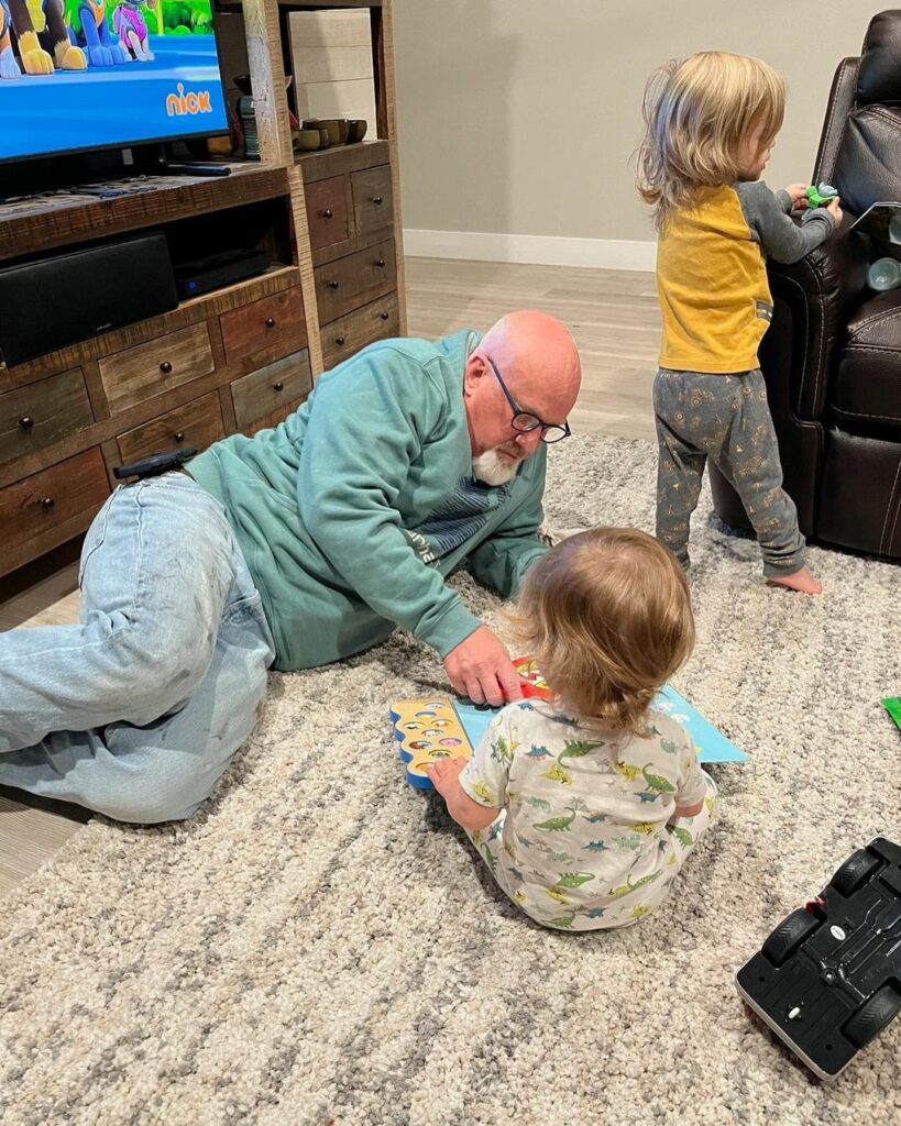 David Woolley playing with grandkids