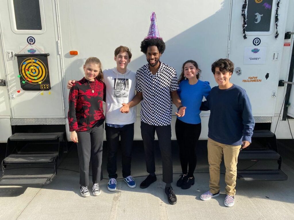 Milan Carter with the cast crew of Warped!