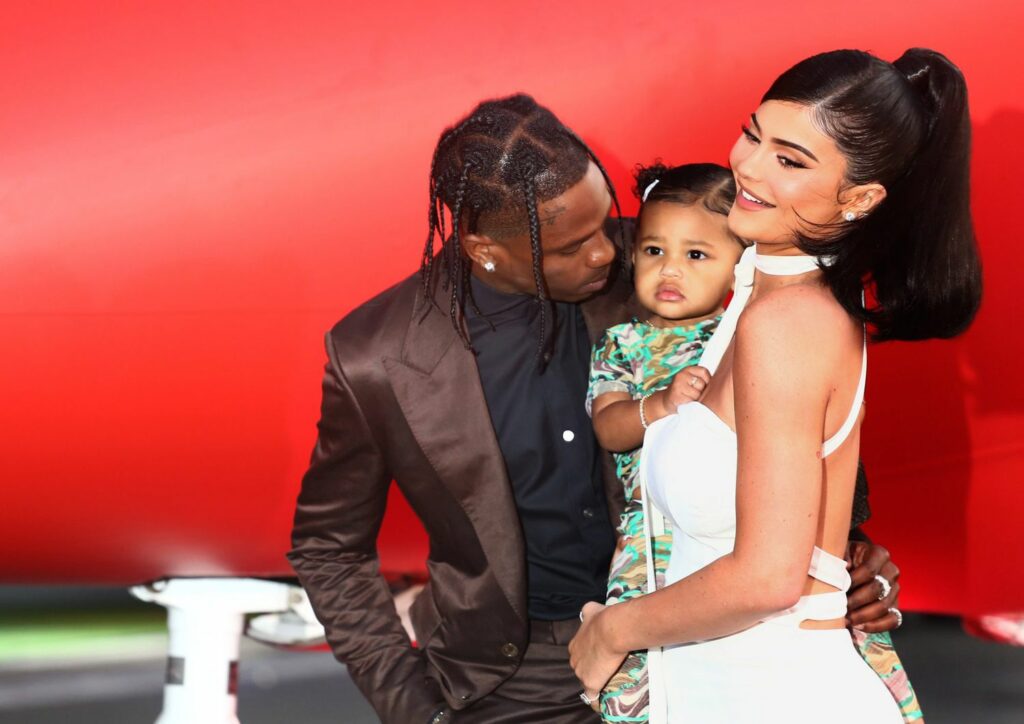 Travis Scott with his partner Kylie Jenner and his daughter