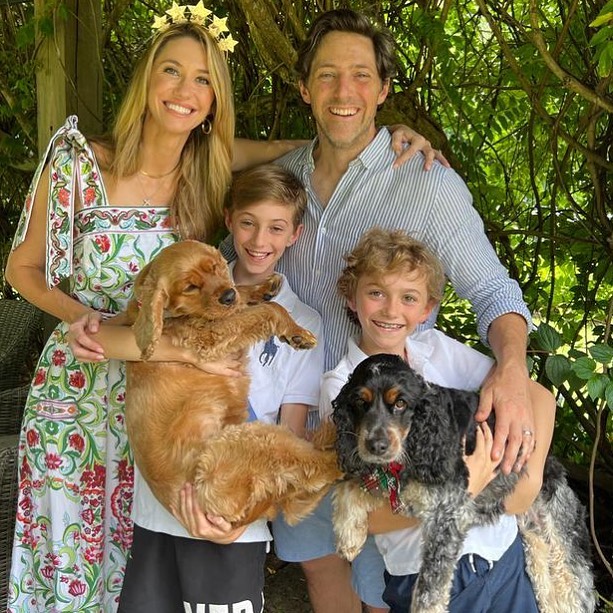 Charlie Albone with his wife and kids