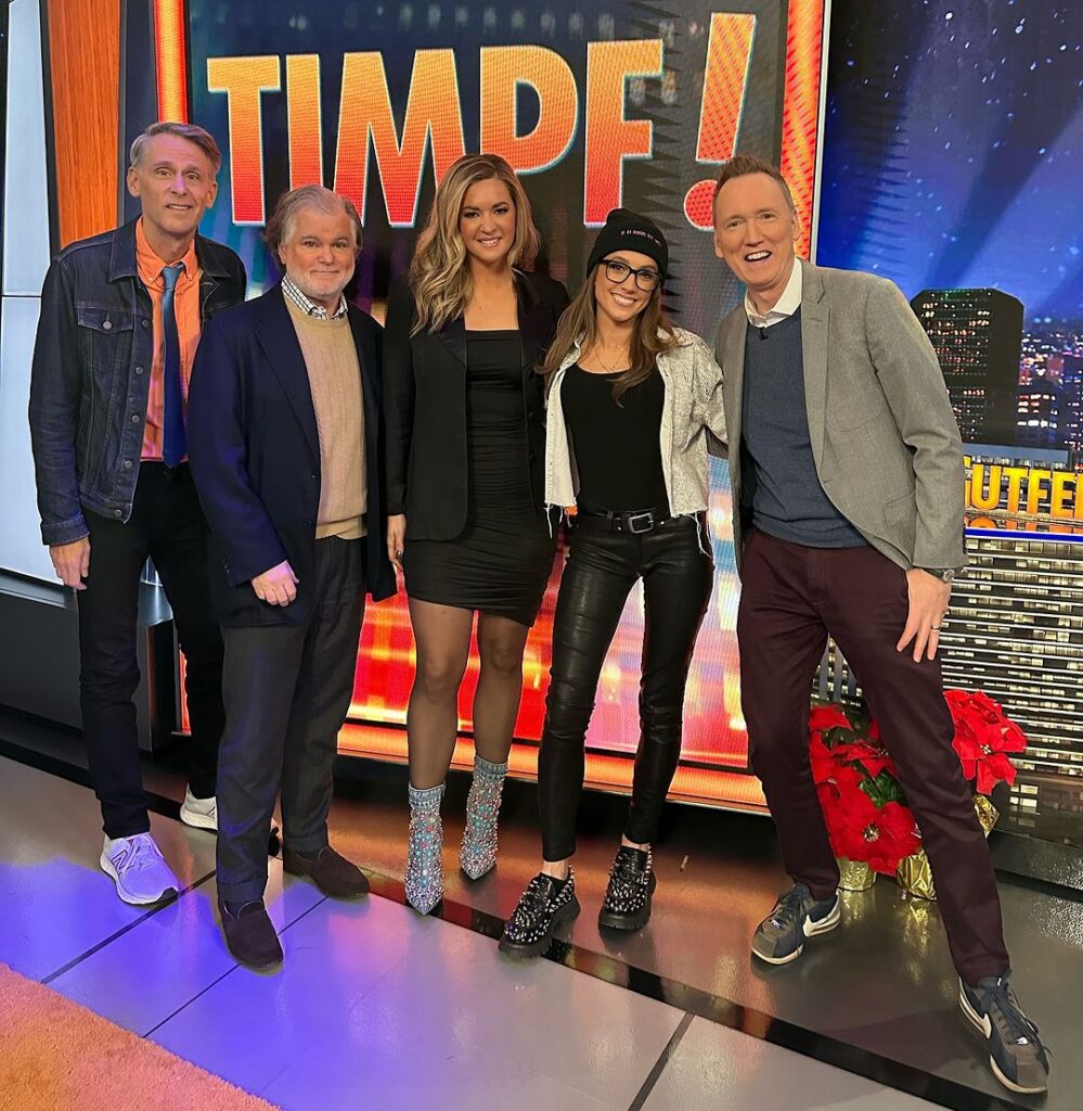 Kat Timpf with other broadcasters