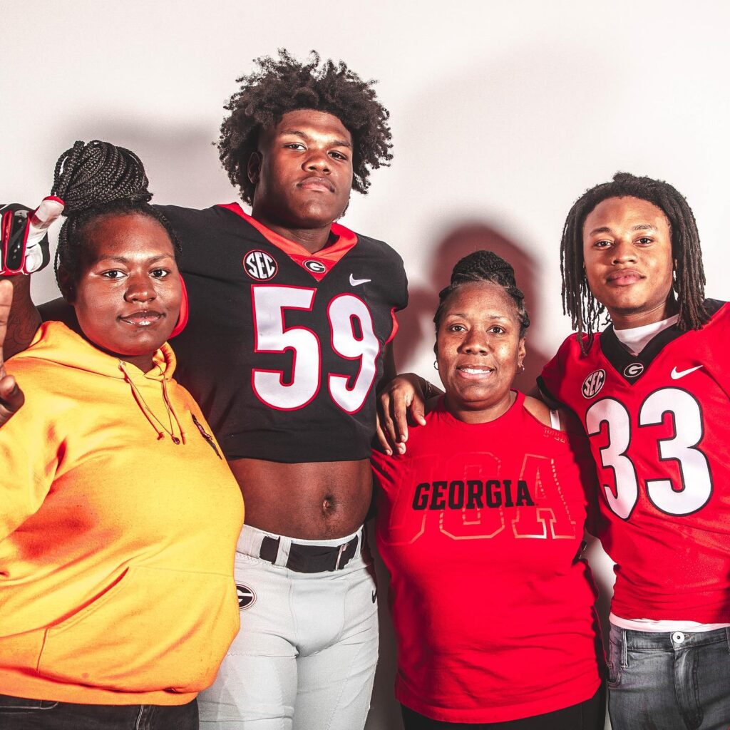 Broderick Jones with her mother and family members
