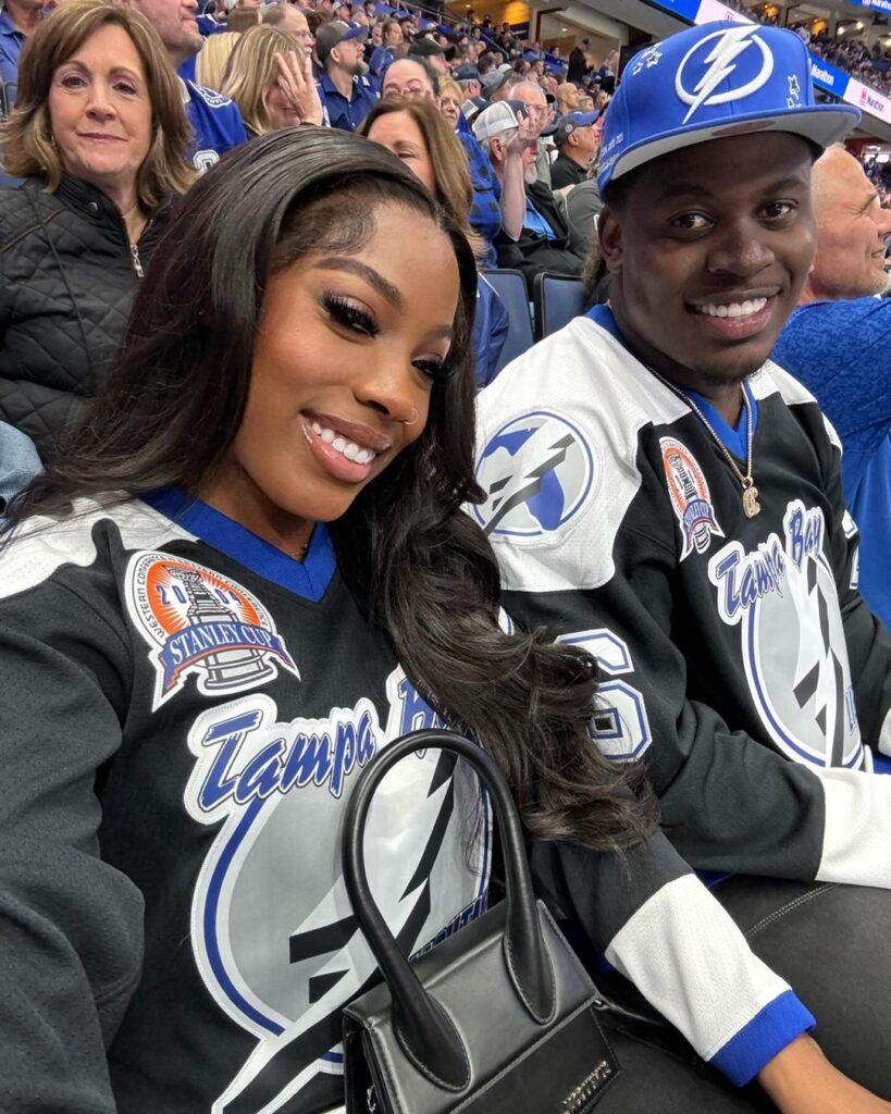 Calijah Kancey with his girlfriend in a basketball stadium