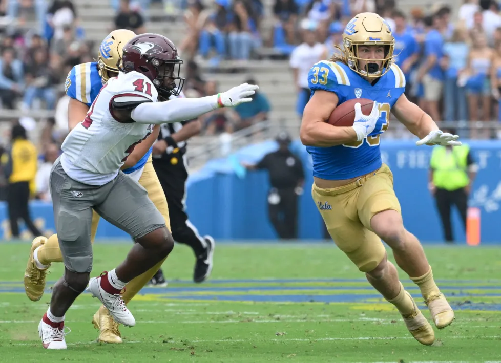 Carson Steele playing football for UCLA