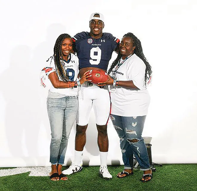 Derick Hall with his mother and sister