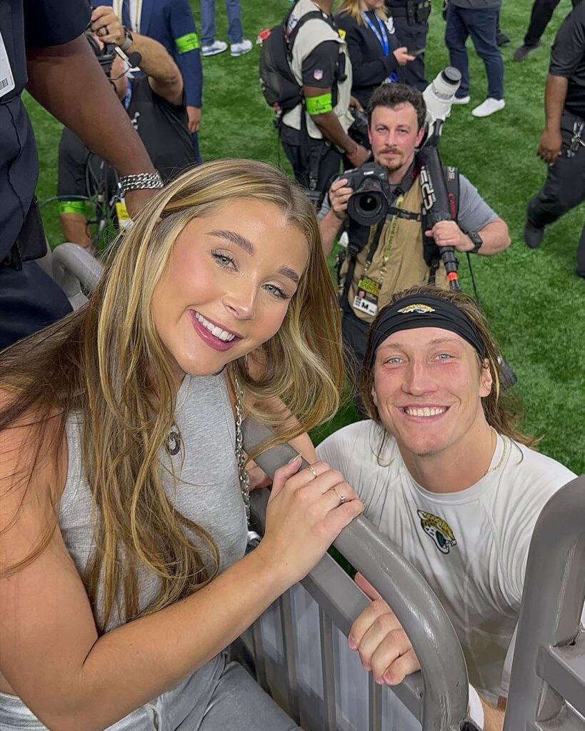 Trevor Lawrence with his wife Marissa in football stadium