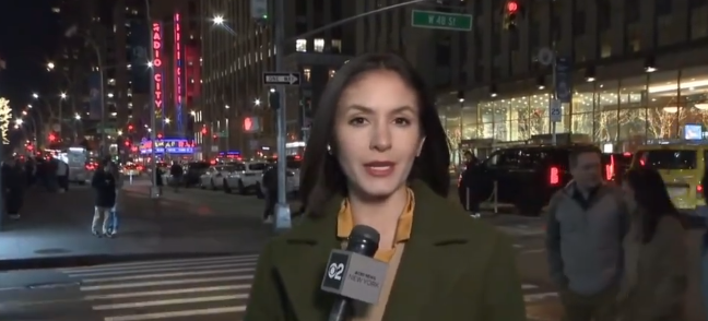 Ali Bauman live reporting on television