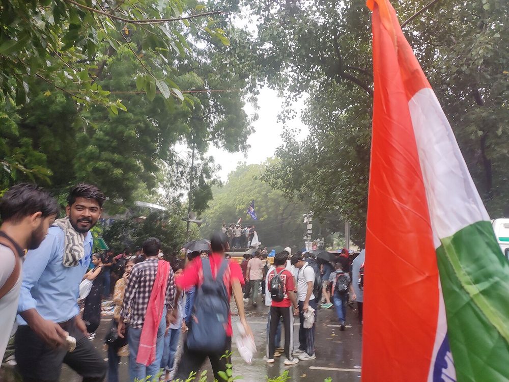 Students marching with the Indian tricolour at the Jantar Mantar protest backed by Abhijeet Dipake's Cockroach Janta Party